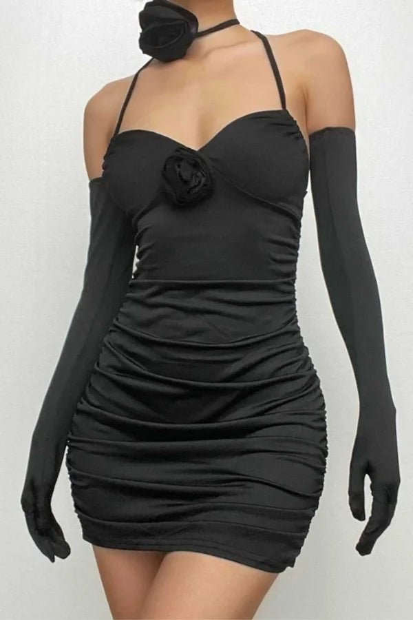 Model wearing Kouvr Fashion Chanti Bloom black ruched mini dress with matching opera gloves and rosette choker