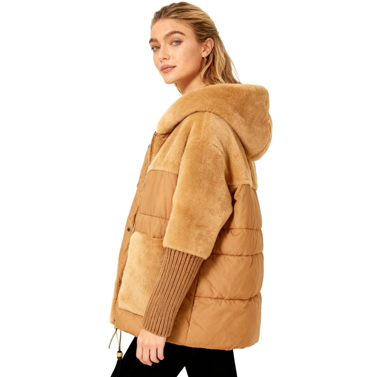 Woman wearing a deep khaki kouvr puffer jacket with a hood on a white background