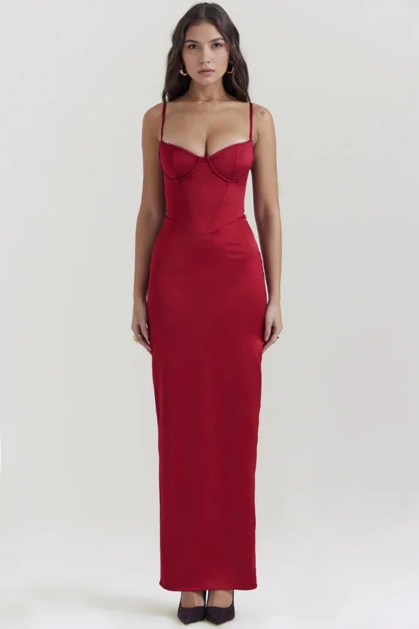 Model wearing the red Haven satin corset maxi gown by Kouvr Fashion, showcasing the vibrant color and elegant silhouette.