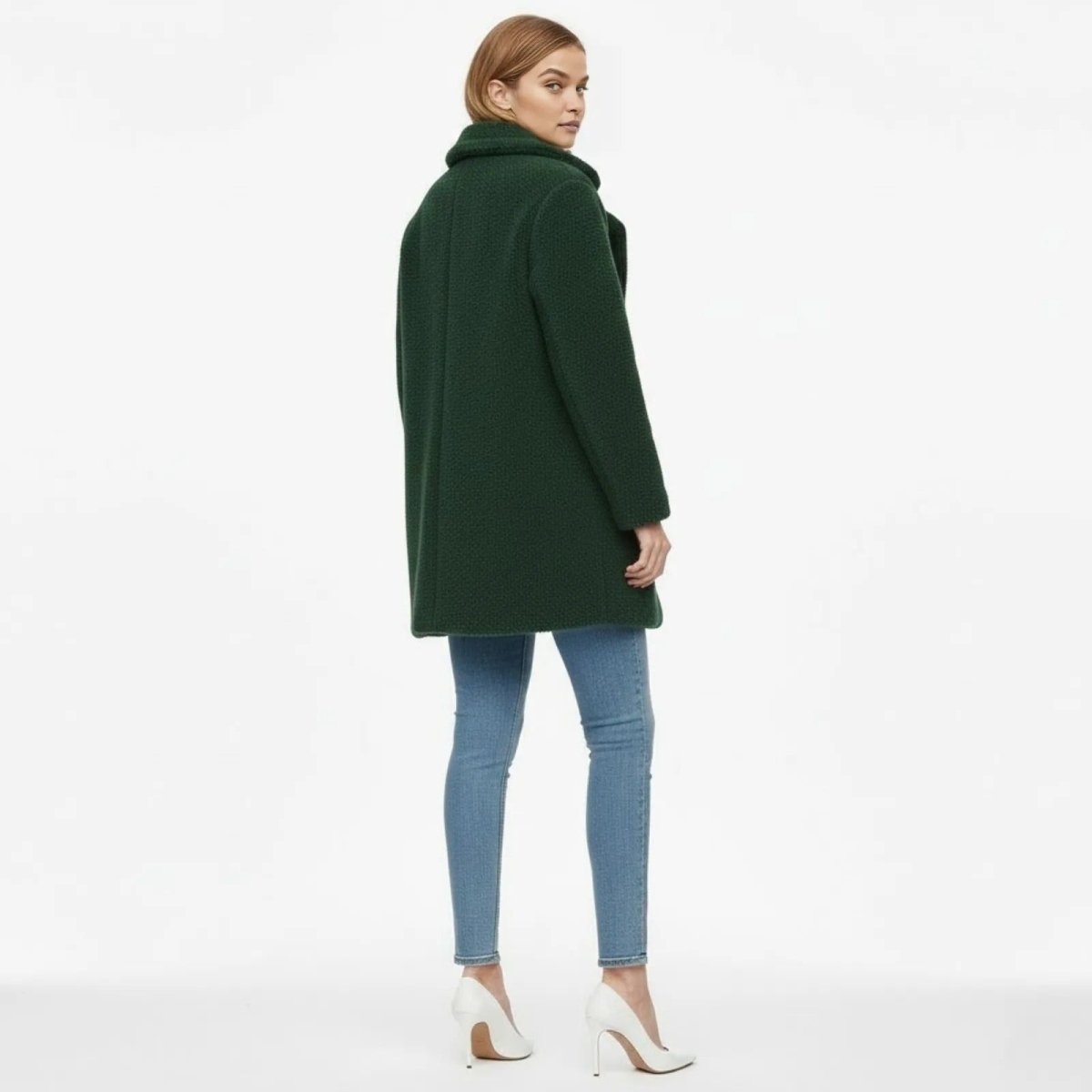 Back view of the Kouvr Fashion green teddy coat, highlighting the tailored fit and rich boucle texture of the fabric.