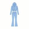 Flatlay product shot of the front of the Kouvr light blue knit hoodie and flared pants set on a white background.