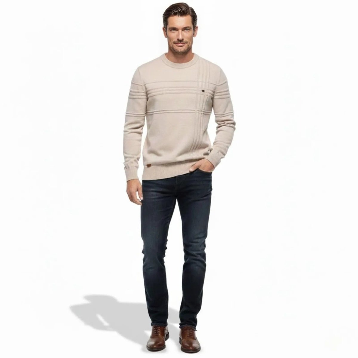 Model wearing the Kouvr Fashion men's apricot textured grid crewneck sweater, front view, with dark jeans.