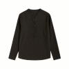 Flat lay photo of the front of a men's black long sleeve henley shirt with a band collar, showing the button placket and fabric texture.
