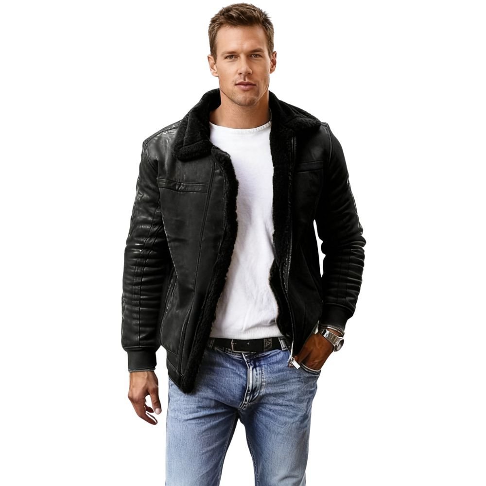 Man wearing a black kouvr leather jacket, white shirt, and blue jeans on a white background