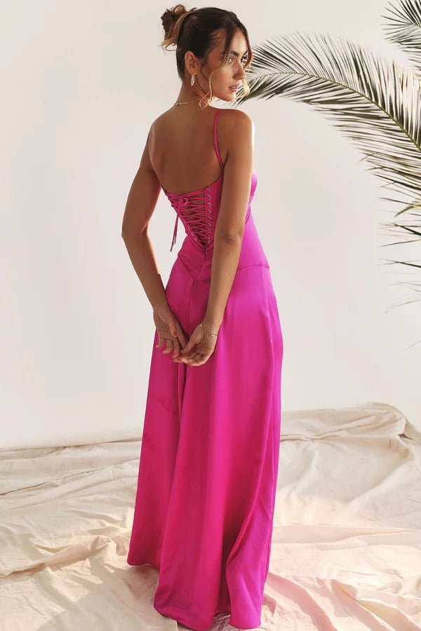 Model wearing the Kouvr Gabriella Gown in Fuchsia Satin with a lace-up corset back.