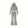 A flatlay product image of the Kouvr Fashion grey two-piece outfit, showing the front of the cropped zip hoodie and flared pants.