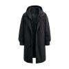 Studio product shot of the black Kouvr Hartley technical coat, open to show the inner zippered layer.