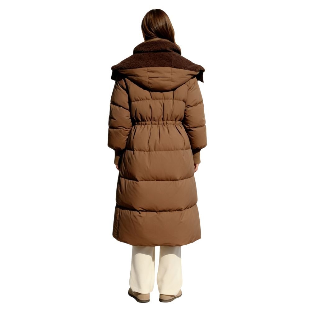 Model wearing the women's long black hooded down puffer coat