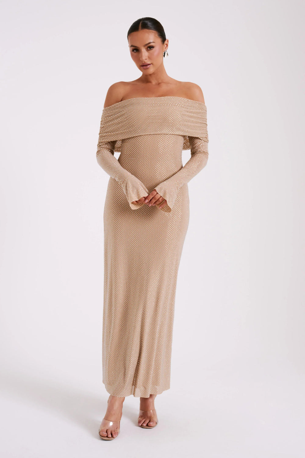 Model from behind in Kouvr Jada Beige off-the-shoulder formal gown with flare sleeves