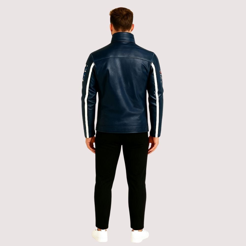 Man wearing the Kouvr Jayce Men's Navy Blue Leather Racer Jacket with embroidered patches and white