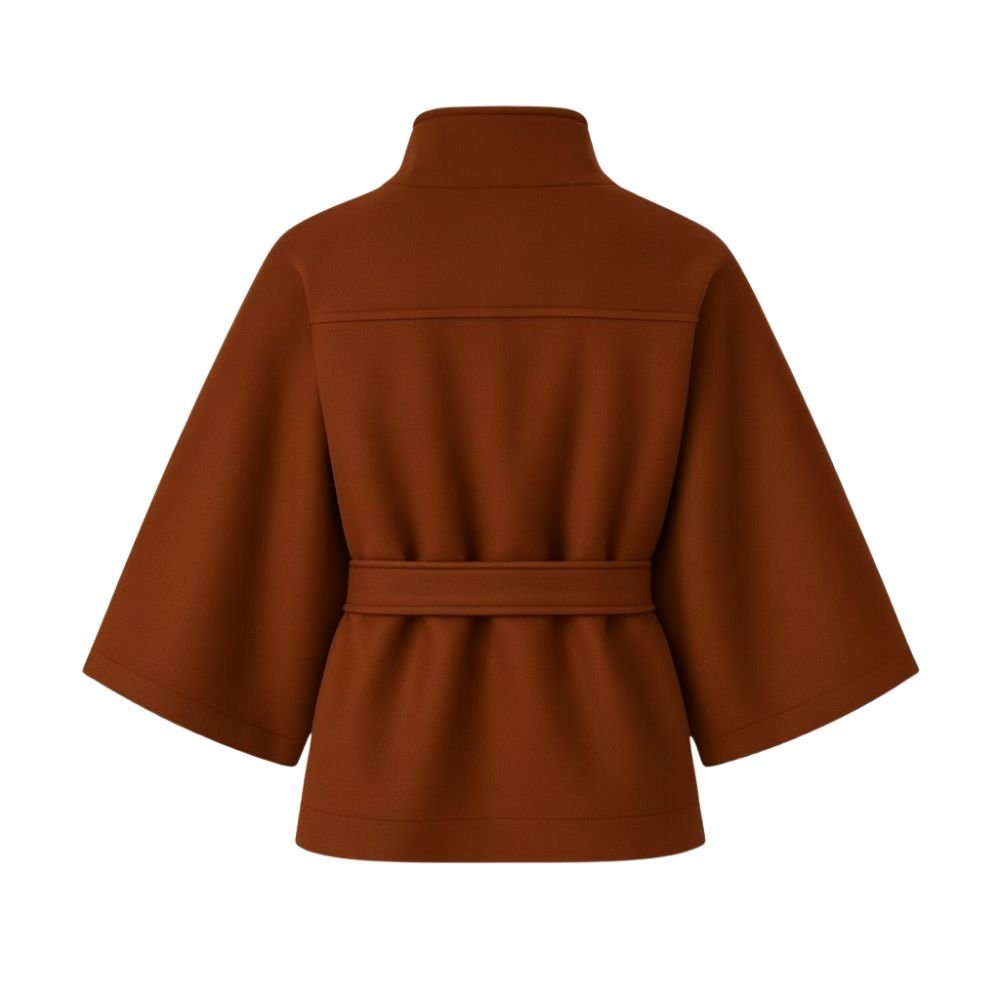 Model wearing Kouvr Fashion belted cape jacket with funnel neck and wide kimono sleeves