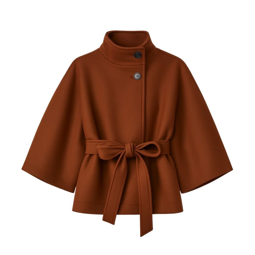 Model wearing Kouvr Fashion belted cape jacket with funnel neck and wide kimono sleeves