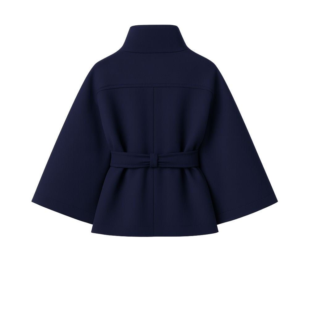 Model wearing Kouvr Fashion belted cape jacket with funnel neck and wide kimono sleeves