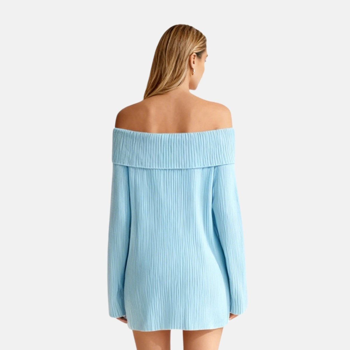 Woman wearing a light blue off-shoulder dress on a white background