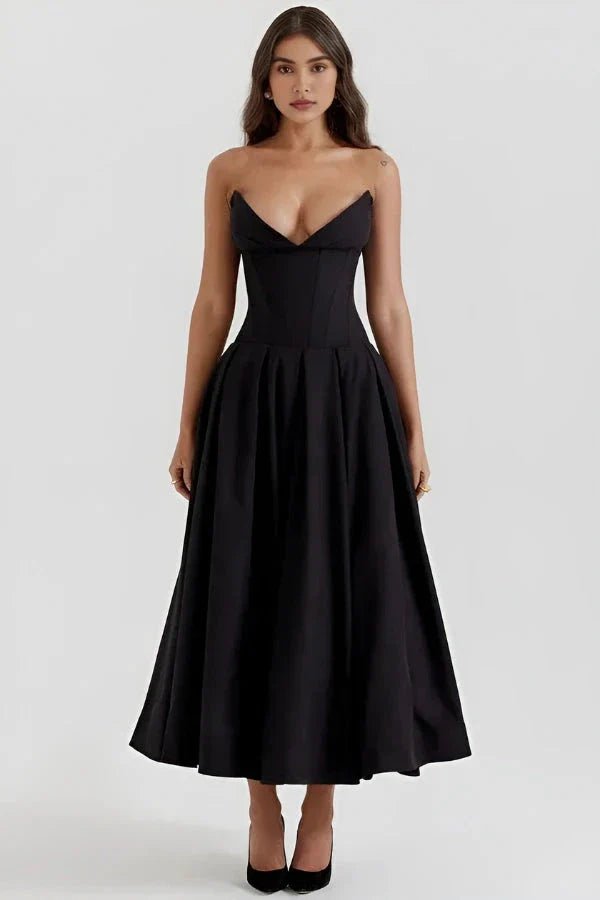 Model wearing Kouvr Fashion's black strapless corset midi dress for a formal event