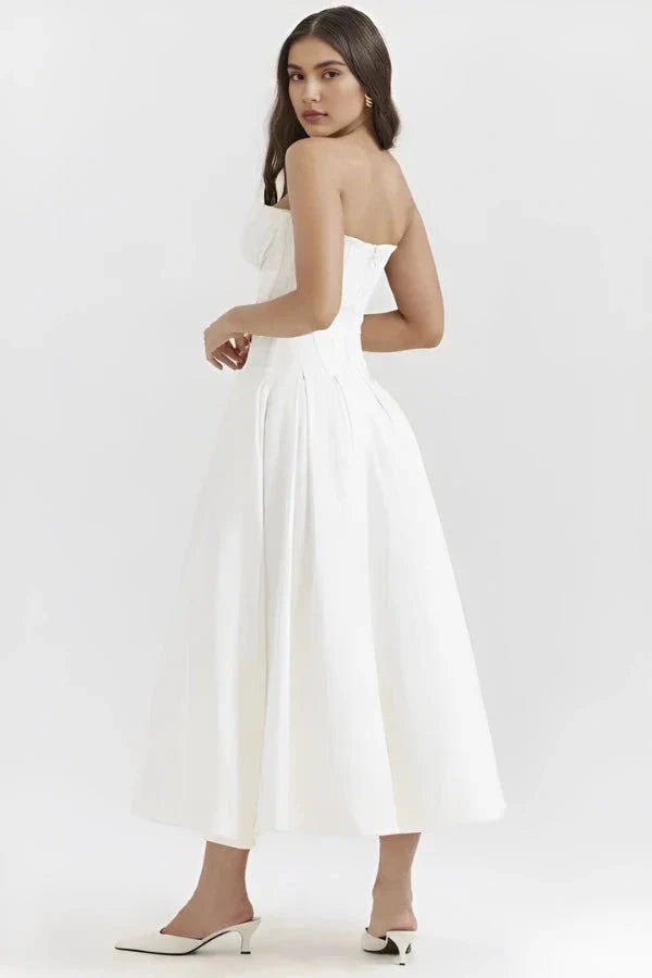 structured bustier dress, tea-length bridal dress, sculpted bodice, architectural silhouette, and modern occasion wear