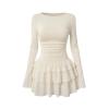 Product flatlay of the Kouvr Leona cream long sleeve dress showing the ruched waist and ruffle details.
