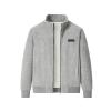 Flat lay photo of an open grey corduroy zip jacket, revealing the full white soft shearling interior and black logo patch.