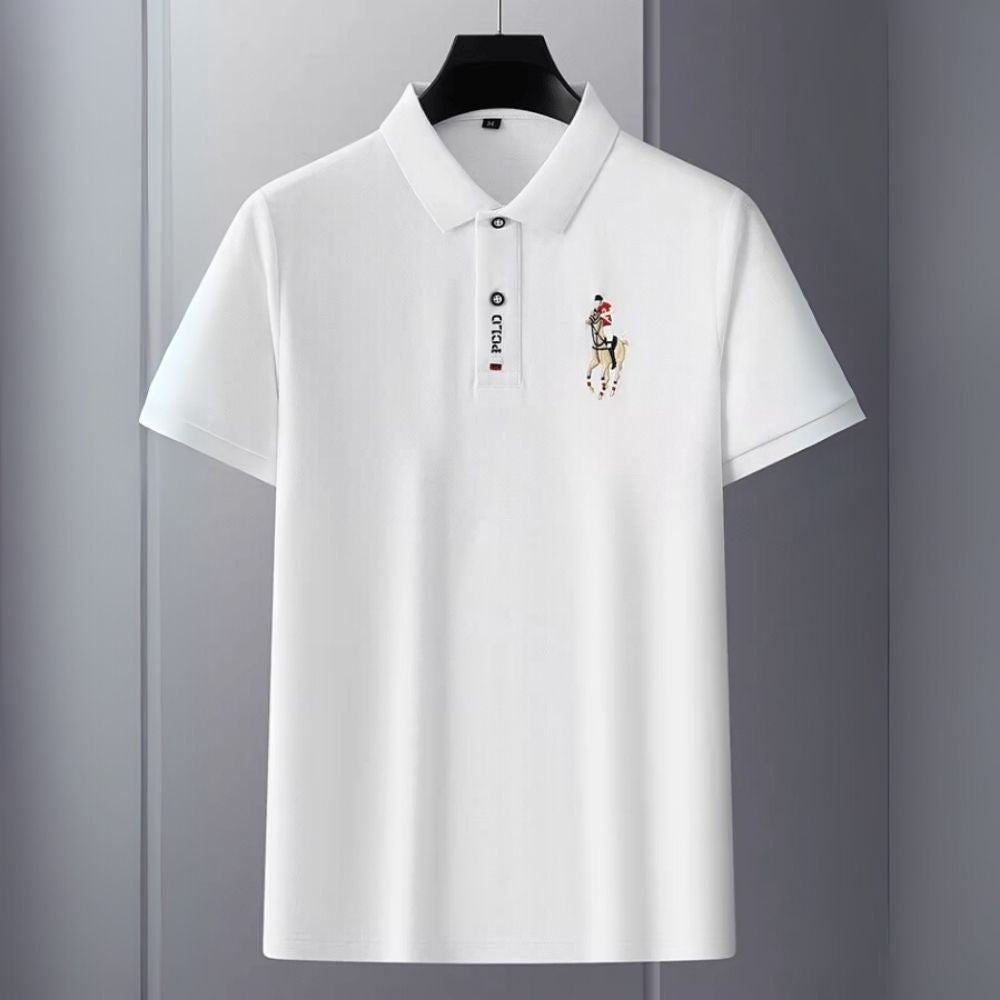 Model wearing the Kouvr white slim fit polo shirt with black trousers.