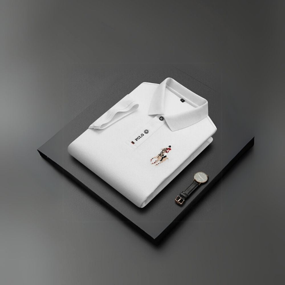 Model wearing the Kouvr white slim fit polo shirt with black trousers.