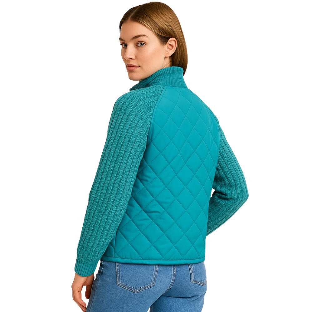 Model wearing Kouvr Mika Hybrid Jacket in Teal (side-back view) with jeans