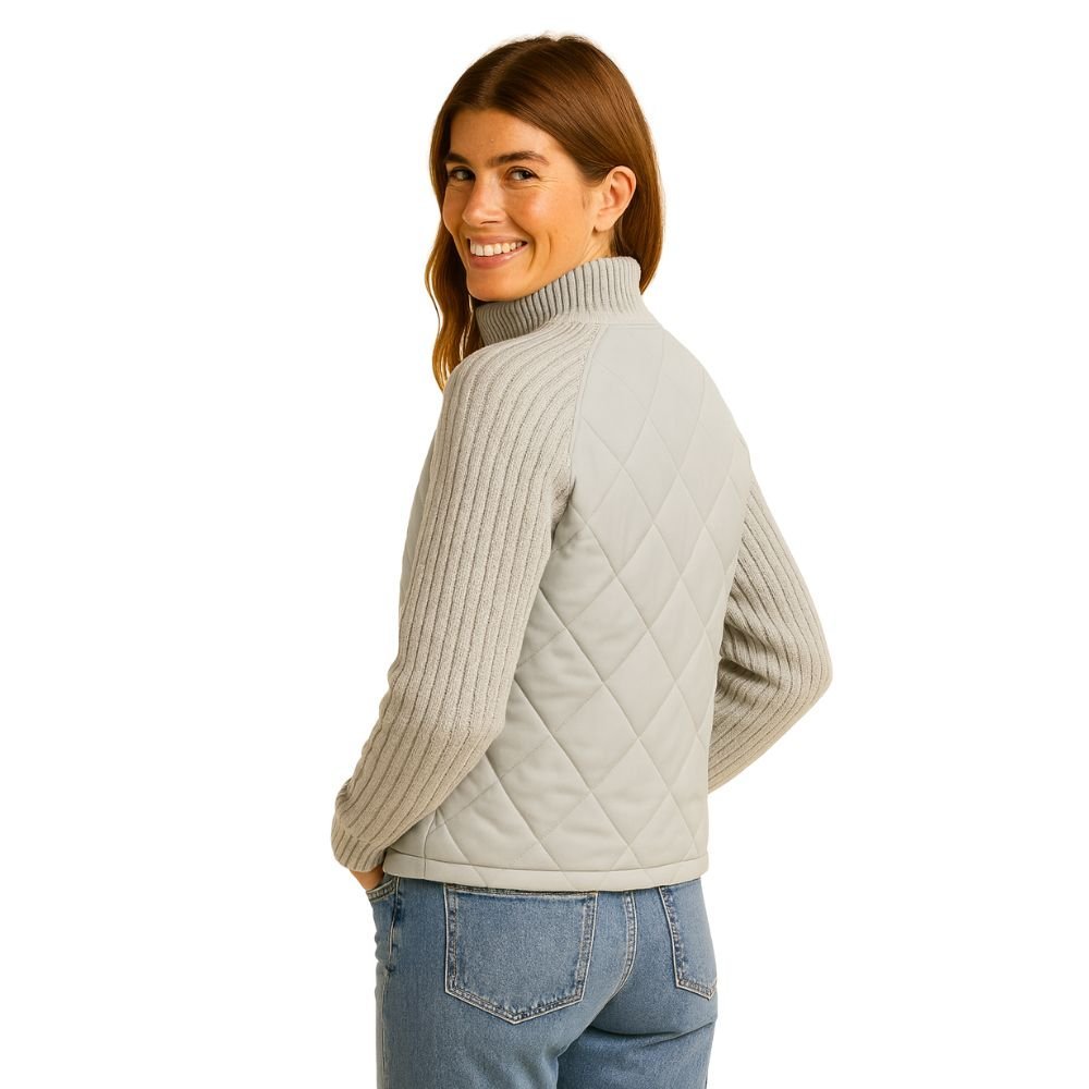 Model wearing the Kouvr Arlington Quilted Hybrid Jacket with blue jeans