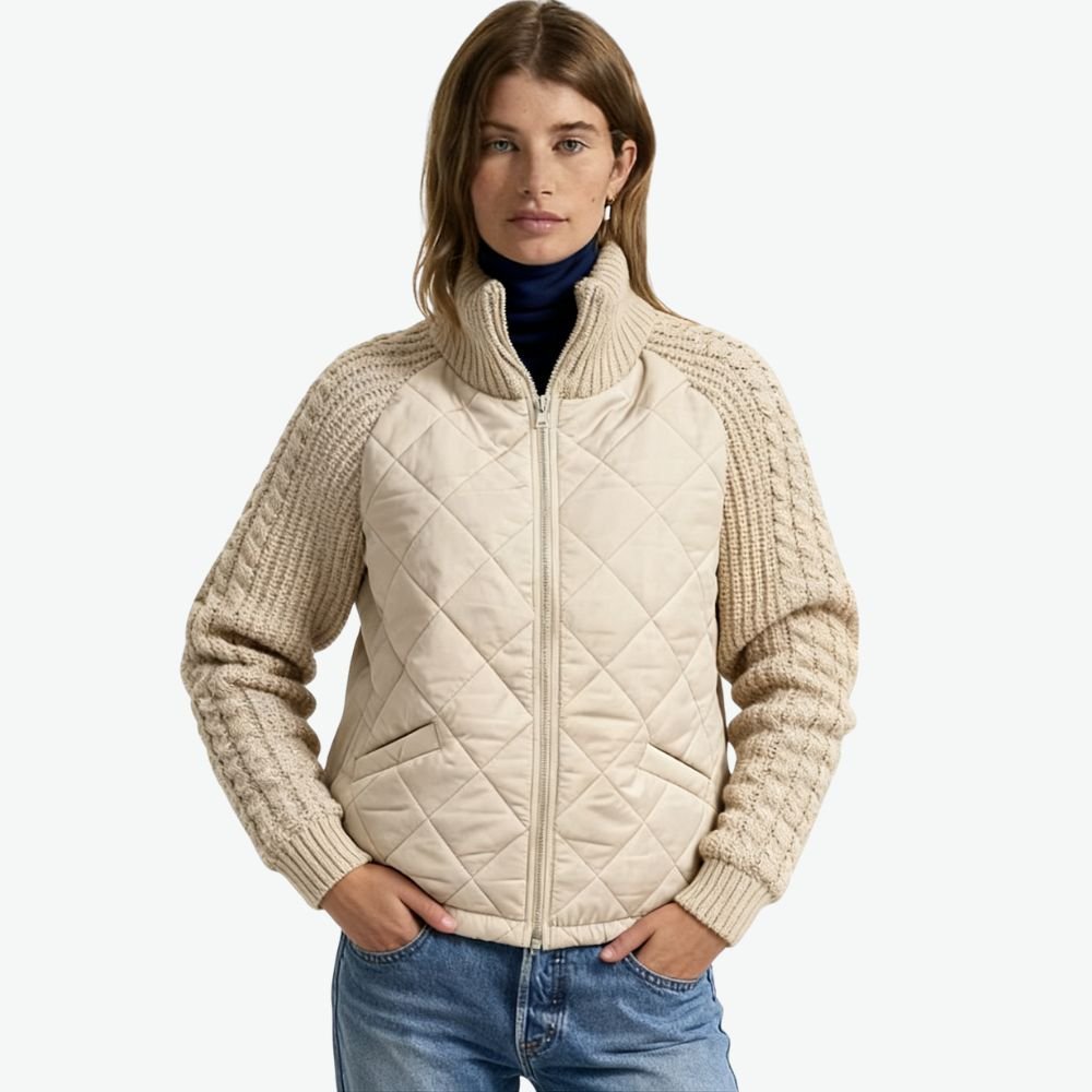 Model wearing the Kouvr Arlington Quilted Hybrid Jacket with blue jeans