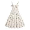 Flat lay of the Nefeli cream floral corset midi dress, highlighting the structured bodice, sweetheart neckline, and all-over blue floral and stripe pattern.