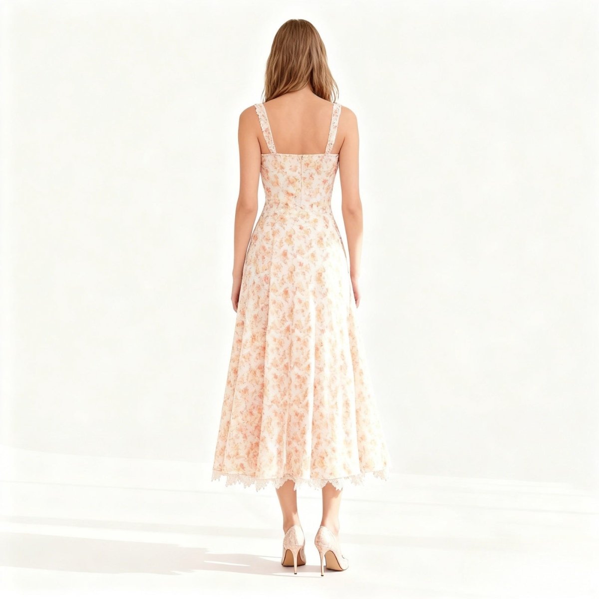 Woman wearing a peach floral dress on a white background