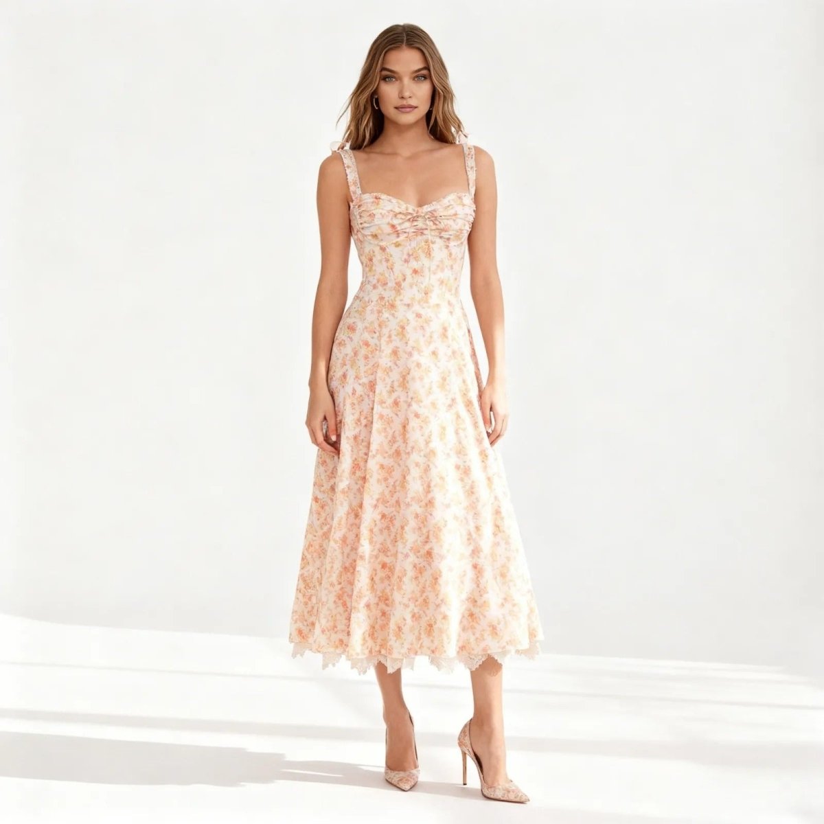 Woman wearing a peach floral dress on a white background