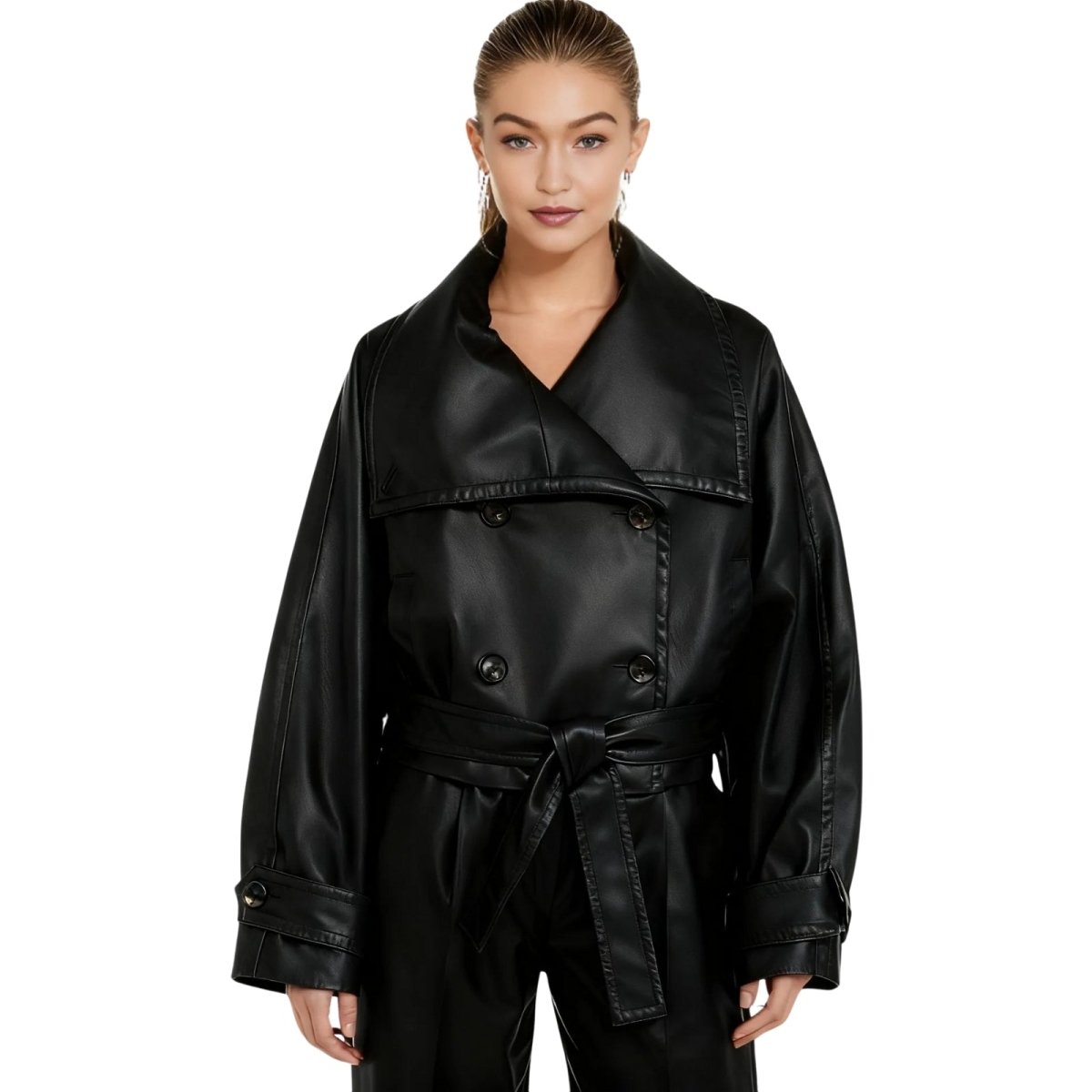 Woman wearing a black kouvr leather jacket on a white background
