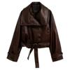 Model wearing the Kouvr Patricia oversized faux leather cropped trench jacket in dark brown