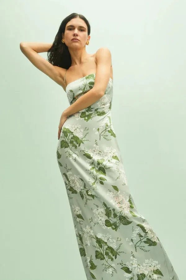 Model wearing the Kouvr Fashion Sage Green Silk Maxi Dress at an outdoor event