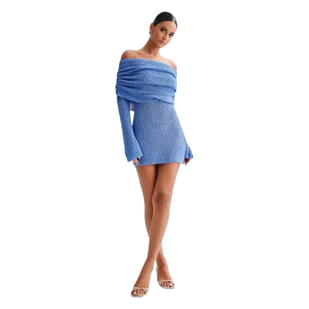 Woman wearing a blue kouvr off-shoulder dress on a white background
