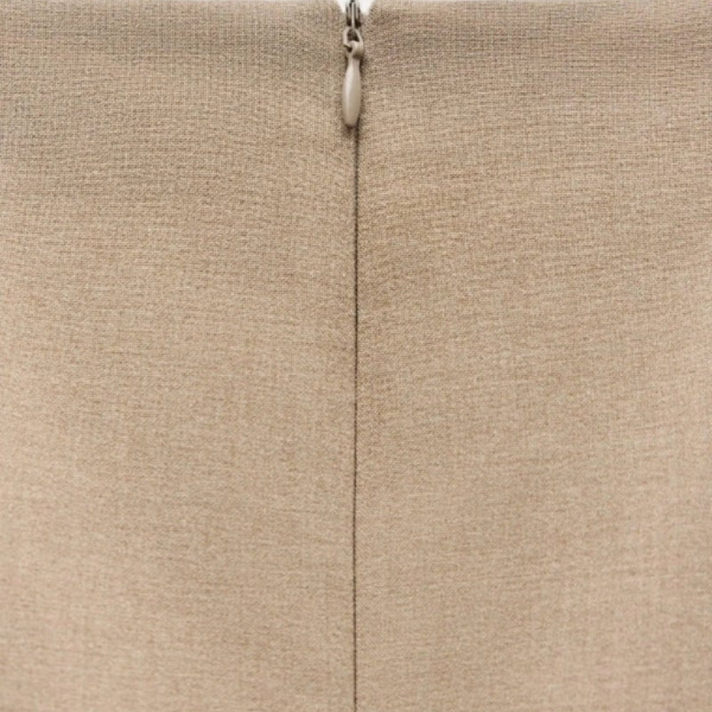 khaki Kouvr blazer worn by a person on a white background