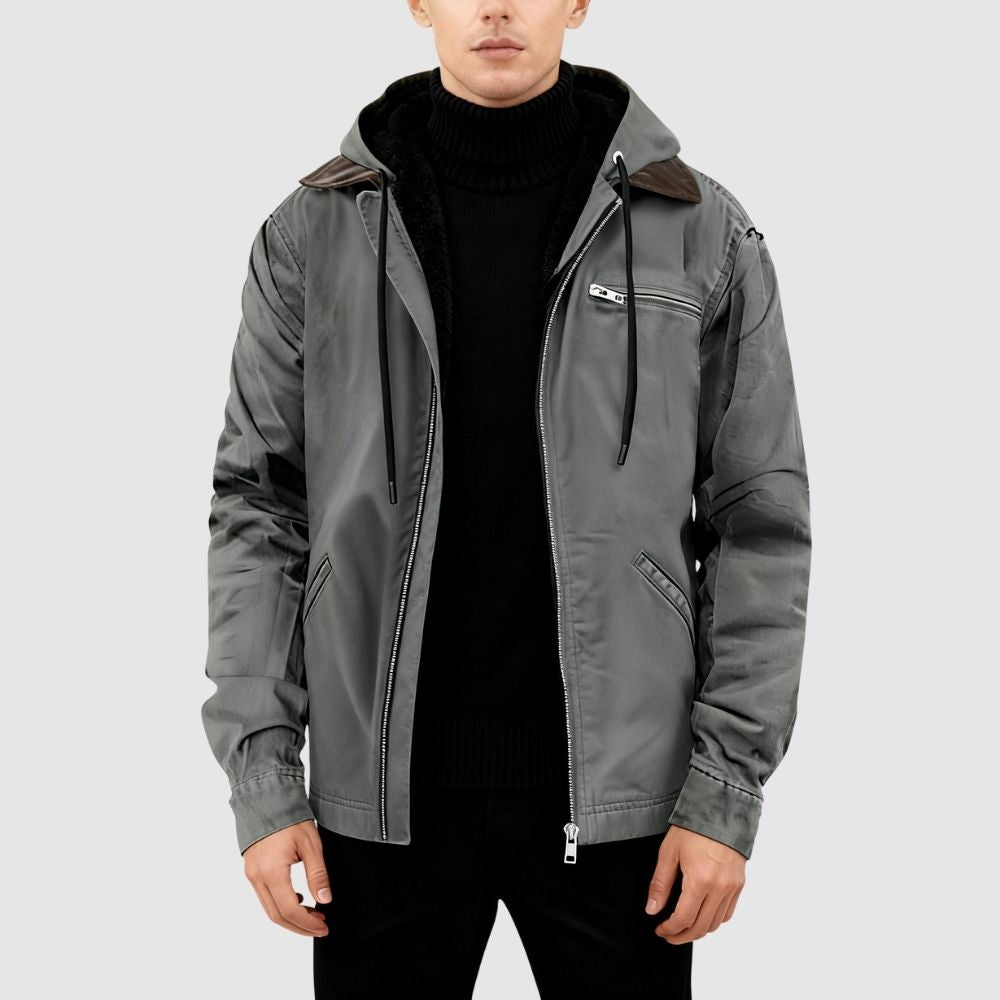 Close-up product view of the Kouvr Tyrian jacket in gray, showing the open zipper and plush black sherpa fleece lining.