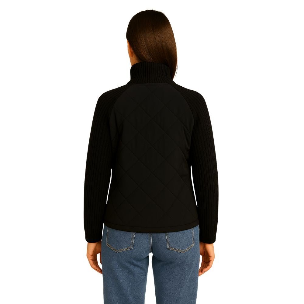 Model wearing the Kouvr Arlington Quilted Hybrid Jacket with blue jeans