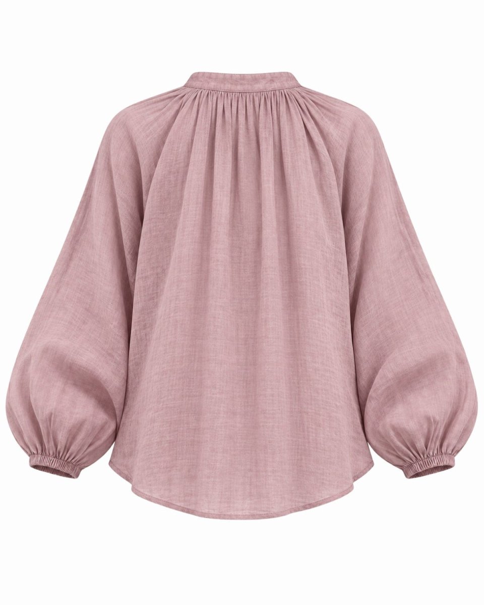 A lavender linen blouse with a high gathered neckline, voluminous balloon sleeves, and elastic cuffs, shown from the back on a white background.