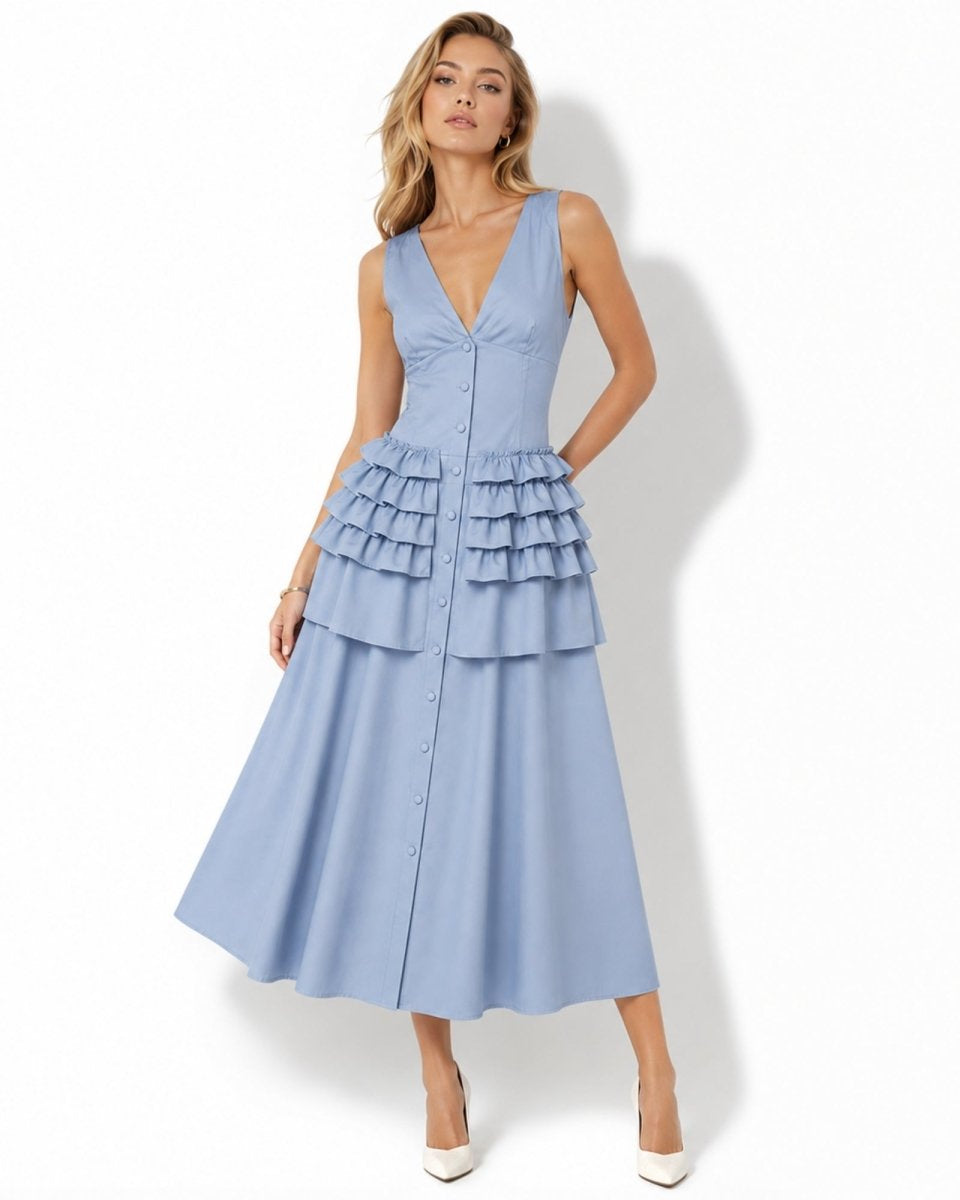 Product laydown of light blue sleeveless tiered ruffle midi dress showing structural stitching and premium fabric details.