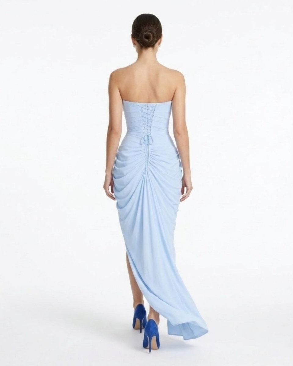 Back view of the Fenlo light blue formal dress highlighting the adjustable corset lace-up back detail and sweeping maxi train.