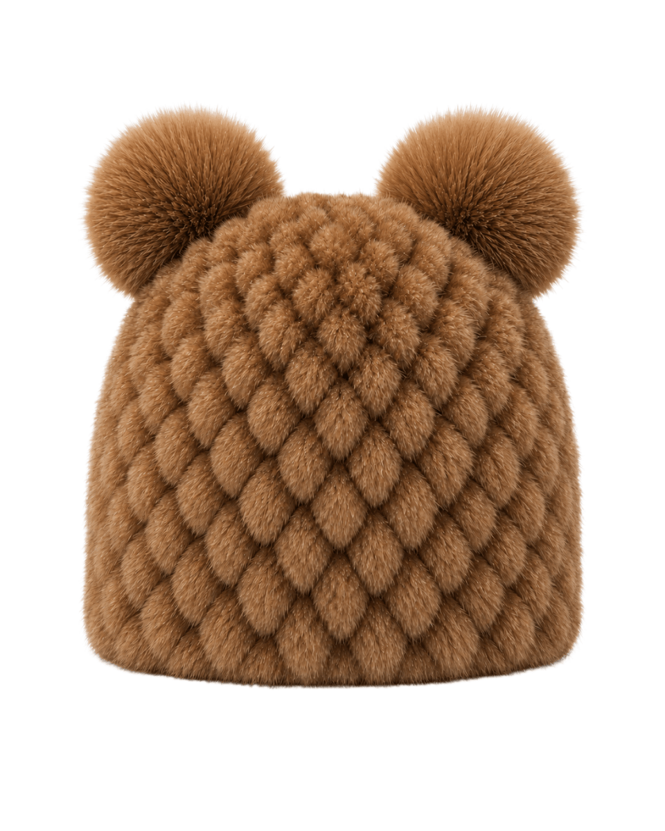 A brown faux fur beanie hat featuring a textured diamond pattern and two matching pom-poms on top, shown against a plain white background.