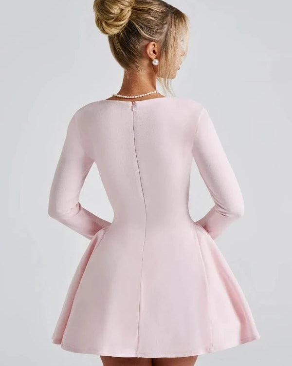 Pink dress worn by a person on a light gray background