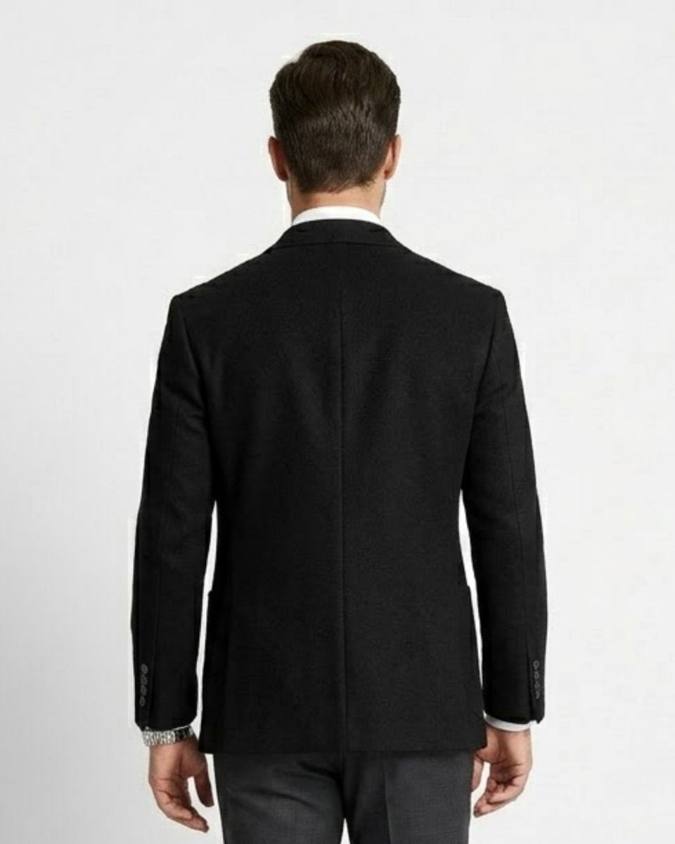 Back view of men's black slim fit sport coat showing double back vents and tailored seams.
