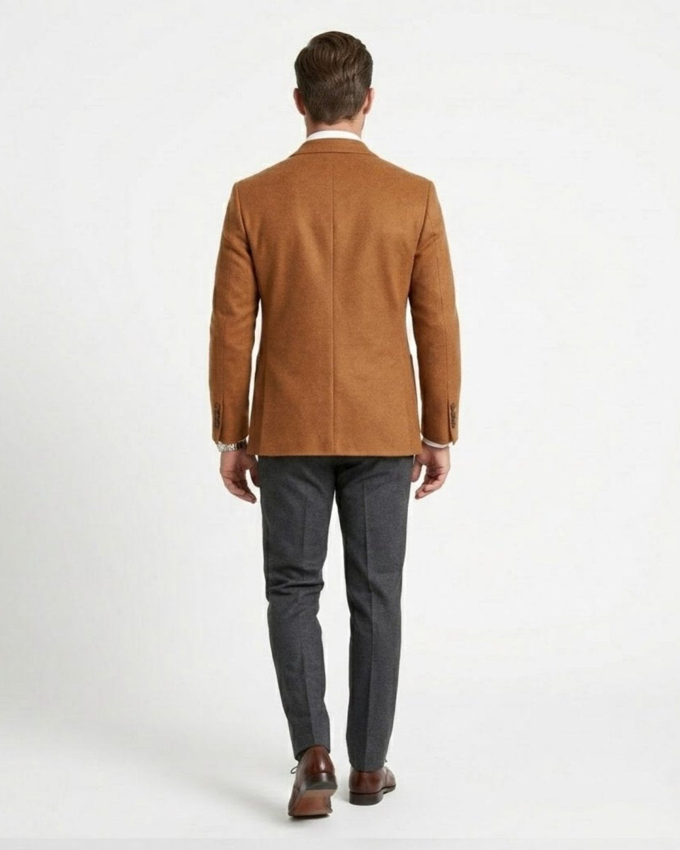 Back profile of male model walking in tailored camel jacket