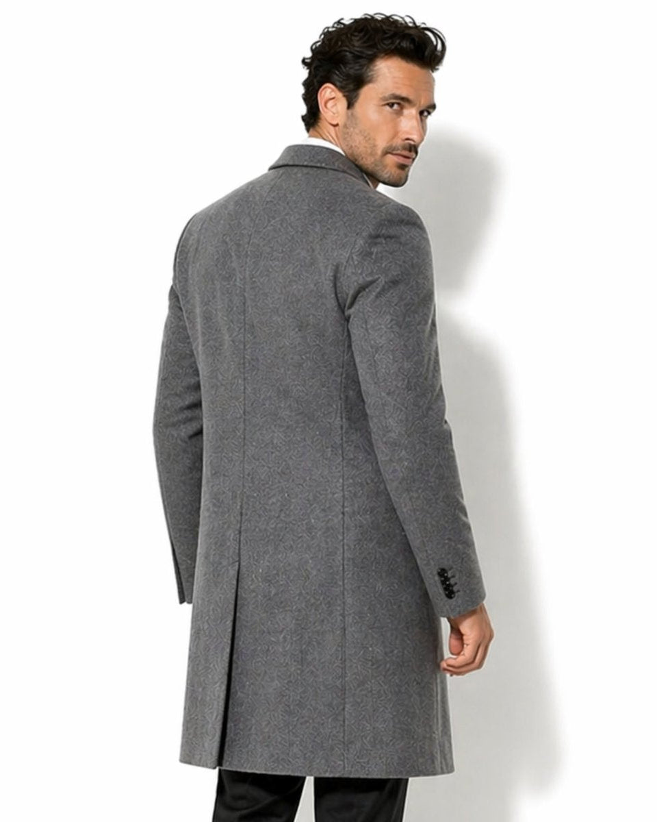 Back styling of men's grey patterned topcoat highlighting the tailored fit, classic collar, and single back vent for elegant movement.