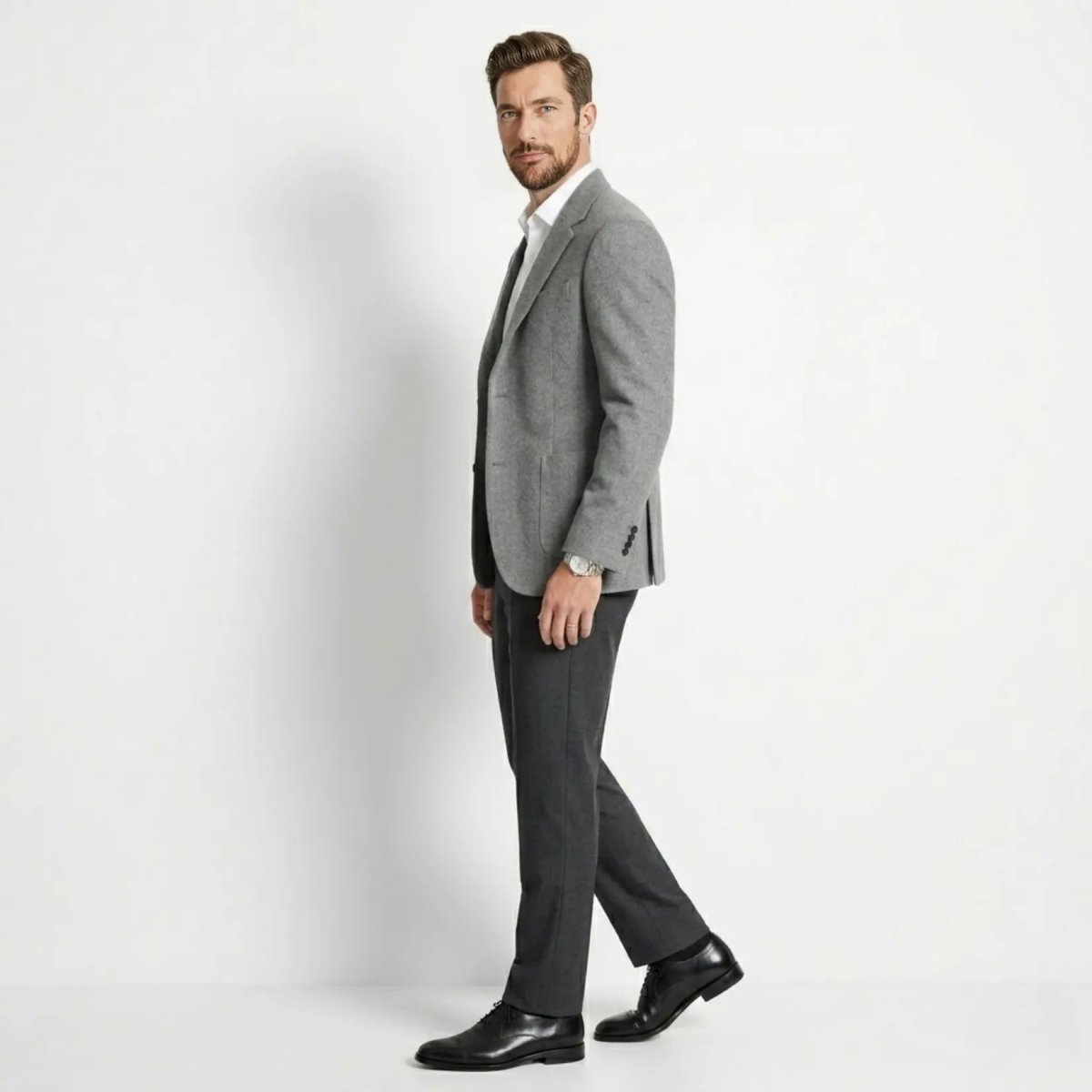 Side profile of man walking in affordable luxury grey wool sport coat