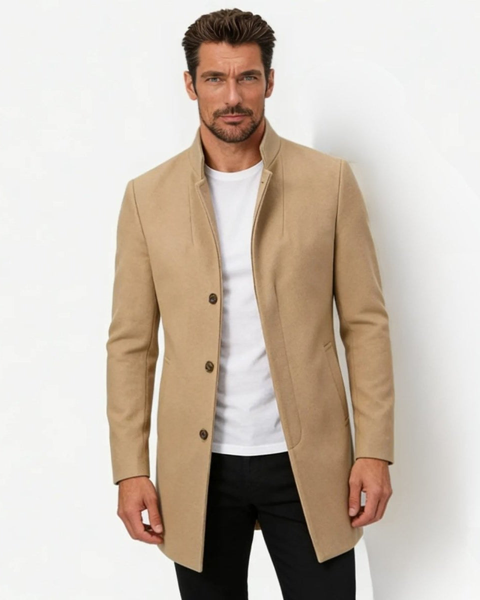 Model wearing the men's slim fit khaki wool stand collar overcoat with a white t-shirt and black trousers against a white background.