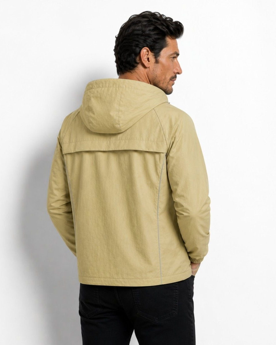 Back view of the light army green lightweight windbreaker showing ventilated back yoke design and hood.