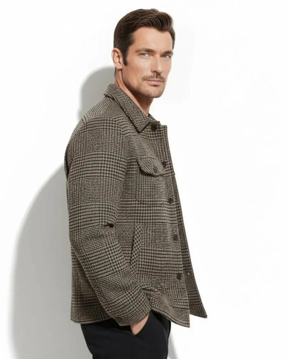 Side profile of a man wearing the wool-blend overshirt in a brown houndstooth pattern, showing the fit and sleeve length.