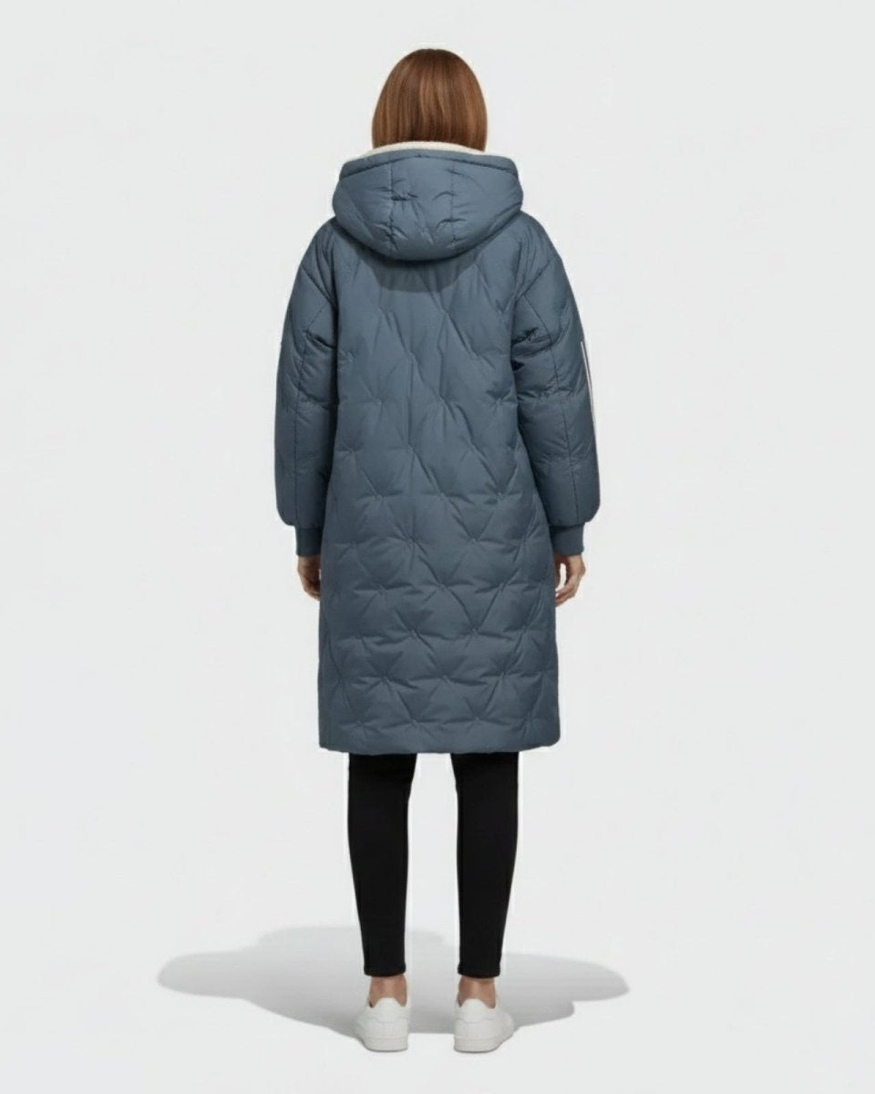 Back view of a woman wearing the Meridian parka, highlighting the diamond quilting pattern and oversized hood.